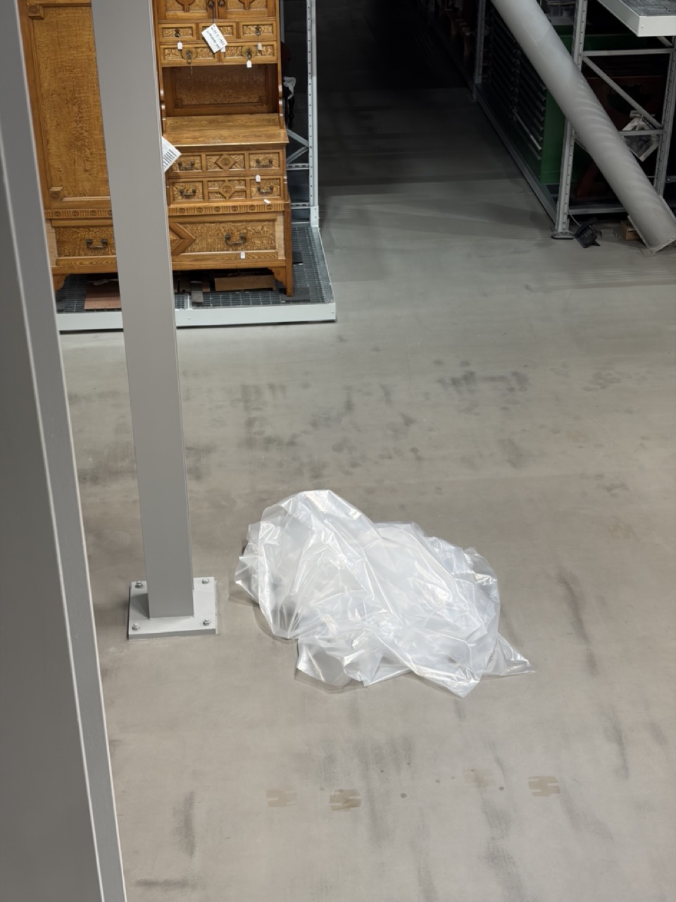 Photograph of protective plastic sheeting on the floor of the V&A Storehouse in London